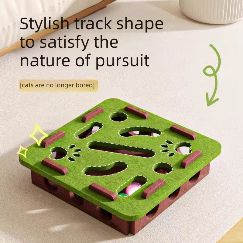 Close-up of the green square Felt Maze Cat Toy Box showing the track-shaped holes and hidden bell balls inside